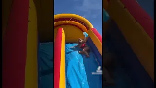 Woman Fails Hilariously on Multiple Instances While Sliding Down Giant Waterslide - 1334170