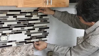 Install backsplash tile in kitchen