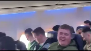 Celtic Fans Enjoying A Flight To Norway - singing top of the league looking down on the rangers