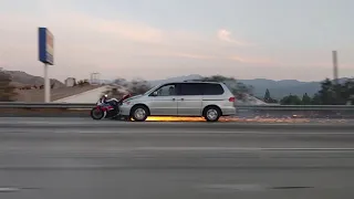 'Where's the Motorcyclist?' Speeding Minivan with Motorbike Embedded in Front Leaves Trail of Sparks