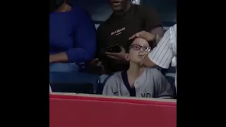 Little dude took a 106 MPH Giancarlo Stanton home run right to the head.