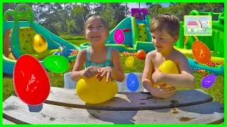 Giant Surprise Egg Hunt on Huge Little Tikes Inflatable Water Slides! Outdoor Play