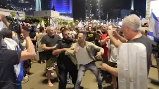 Scuffles as Israeli police use water cannons to disperse weekly anti-government protest in Tel Aviv