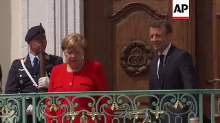 Merkel welcomes Macron to Germany for talks ahead of EU summit