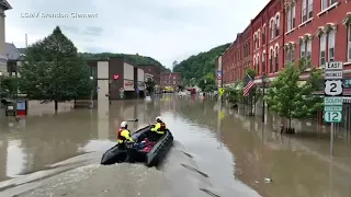 Flooded New England communities shift to recovery, shoveling out tons of mud and debris