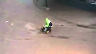 Lady Tries To Cross Flooded Street Fail