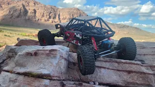 axial capra 4ws hitting the rocks