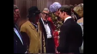 Dame Edna greets The Queen Mother & The Prince & Princess of Wales