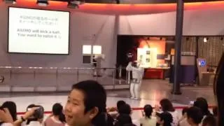 Asimo the robot plays football