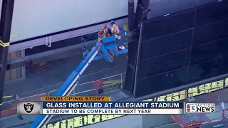 Crews install glass at Allegiant Stadium