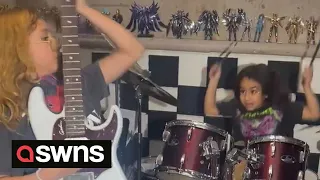 Young siblings rock out on drums and guitar - aged ten and eight | SWNS