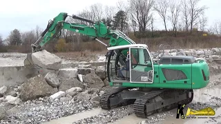 LIEBHERR 922 Excavator Digging and Posing Rocks