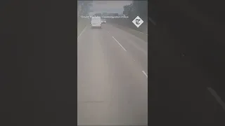 Moment motorist is forced to swerve out of  the way by overtaking van