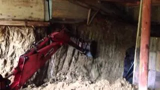 Honda tractor digging hard clay with backhoe