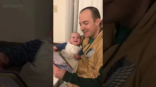 Baby laughs adorably as father reads to her in different voices