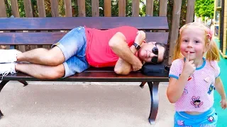 Nastya and sleeping dad are having fun in an amusement park