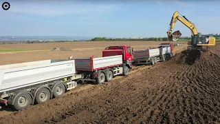 Unique dump trucks Tatra and excavator on highway construction