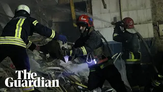 Rescuers dig through rubble after strike hits residential district in Ukraine's Dnipro