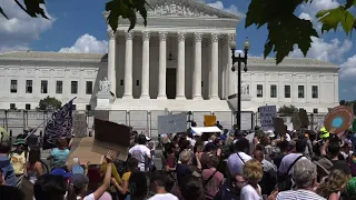 Dueling protesters outside Supreme Court building
