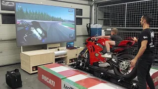 Young kid rides a Ducati Panigale V4s at Brno Circuit on Moto Trainer Simulator