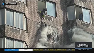 Dramatic video shows FDNY rescue woman in Manhattan high-rise fire