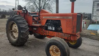 orange green and red  more  tractors coming into the lot