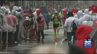 Runners brave freezing rain and strong winds at Boston Marathon