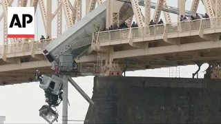 Truck driver rescued from dangling semi in Louisville, Kentucky