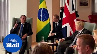 PM Boris Johnson praises vaccines while meeting Brazil's unvaccinated president Jair Bolsonaro