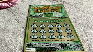 Scratching a $10 Pennsylvania Lottery Scratch Off ticket called The Instant Lottery