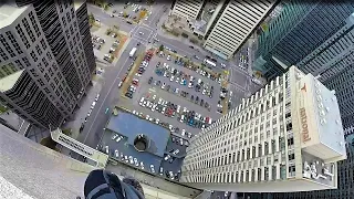 Rope access window cleaning 35 story building with rigging.