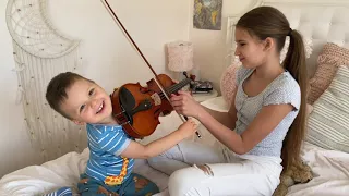 My 2 year-old brother wants to play a full size violin. I am teaching him!!!