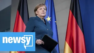 Germany's Angela Merkel returns to work