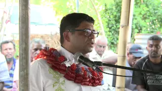 Fijian Attorney General Aiyaz Sayed-Khaiyum presents land leases to Clopcott Squatters.