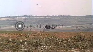 AH-1G Cobra laid smoke screen and UH-1D Huey helicopters in flight, Germany. HD Stock Footage