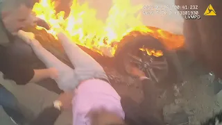 BODYCAM VIDEO | Officer, citizen rescue unconscious man from burning car on Las Vegas strip
