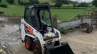 BOBCAT SKID STEER LOADER CLEANING SHEDS OUT