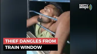 Watch: Thief Dangles From Train Window As Passengers Grab Arms | NDTV Beeps