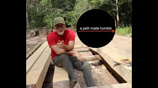 Cutting joinery and installing timber sill plates for off grid cabin.