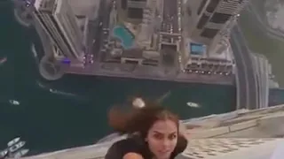 Viktoria Odintcova hangs from Skyscraper for Perfect Selfie