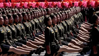 North Korea holds back ballistic missiles in military parade celebration