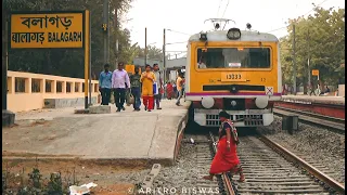 Old EMU local trains quickly accelerating in a crowded station || Eastern Railway