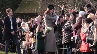 Watch Princess Charlotte refuse to let go of her flowers. Royal Family Attend Christmas Day Service