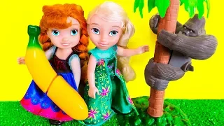 Elsa and Anna toddlers feed cute zoo animal pets