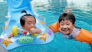 Yejun care of little sister in kids pool and playground