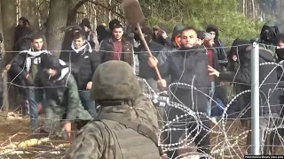 Heightened Tensions On Poland-Belarus Border As Migrants Attempt To Force Down Border Fence