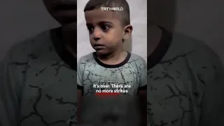 Palestinian child looks terrified after waking up to Israeli air strikes