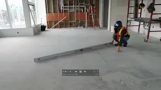 TESTING A CONCRETE SUBFLOOR FOR FLATNESS USING A 10' STRAIGHTEDGE