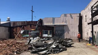 volvo 140 excavator in action demolition job....