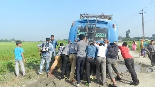 muddy road and the passenger bus